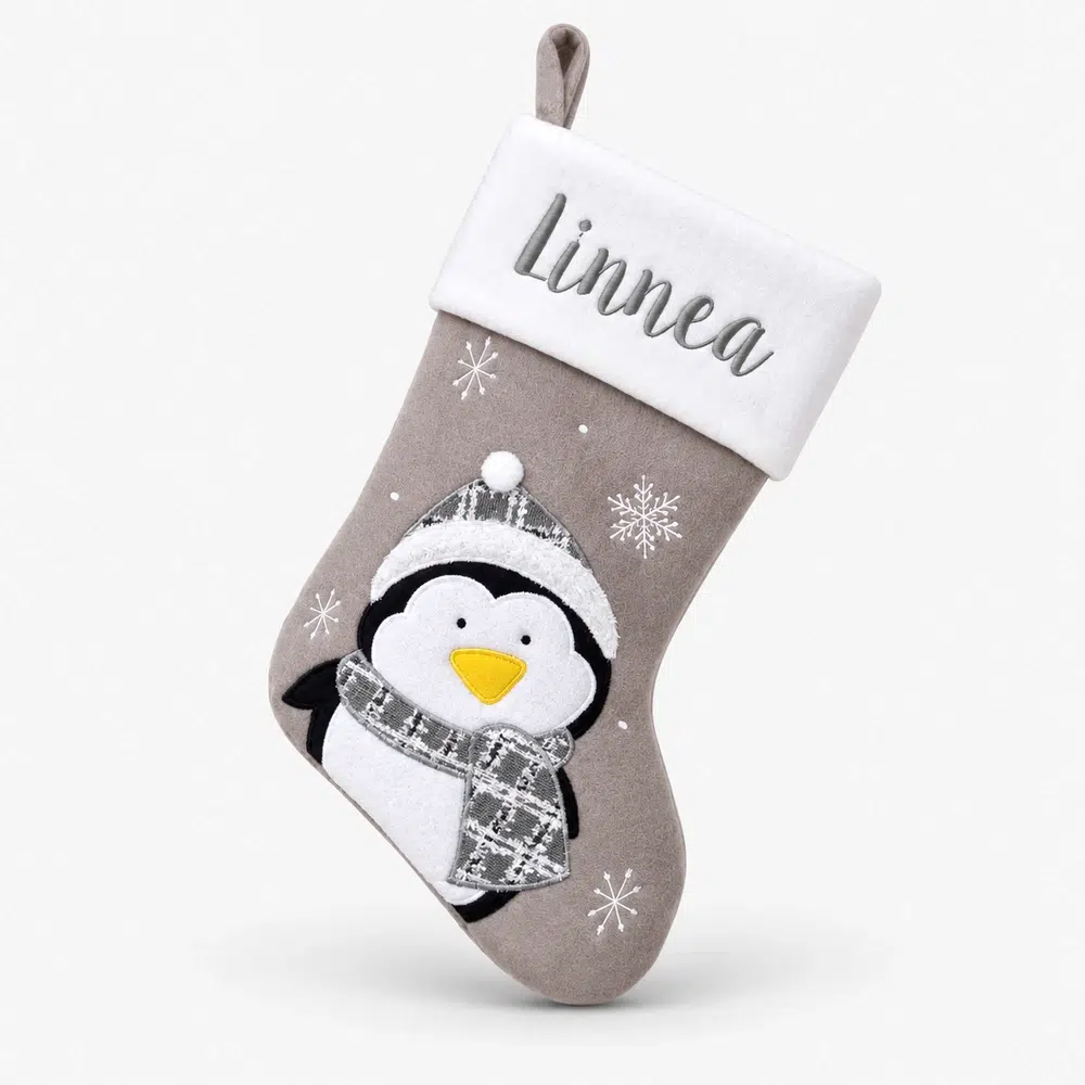 Gray Christmas stocking with name and penguin