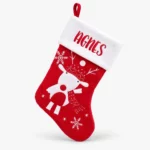 Red Christmas stocking with reindeer and name embroidered