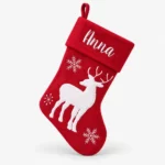 Red Christmas stocking with white reindeer