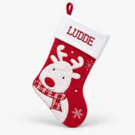 Red and white Christmas stocking with name and reindeer