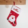 Red xmas stocking with santa motif