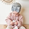 Baby with gray turban