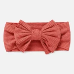Coral colored headband for baby