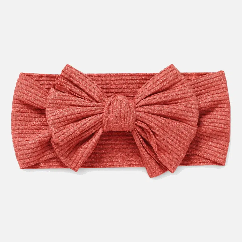 Coral colored headband for baby