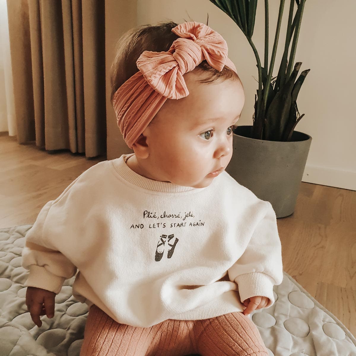 Baby wearing a personalized headband