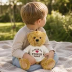 Child hugging a personalized teddy bear