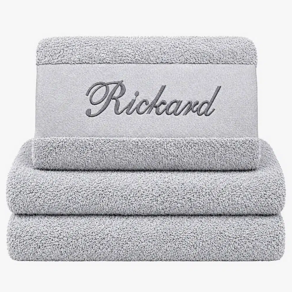 Gray towel with name and black text Gray towel with name and black text